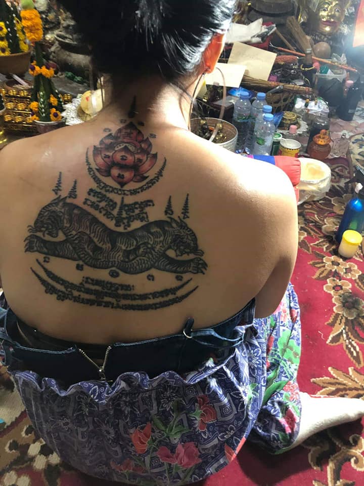 Sak yant tiger tattoo women